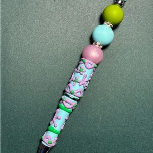 Vibrant Beaded Pen with Green and Purple Accents